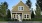 a house with trees and grass