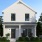 a house with trees and grass
